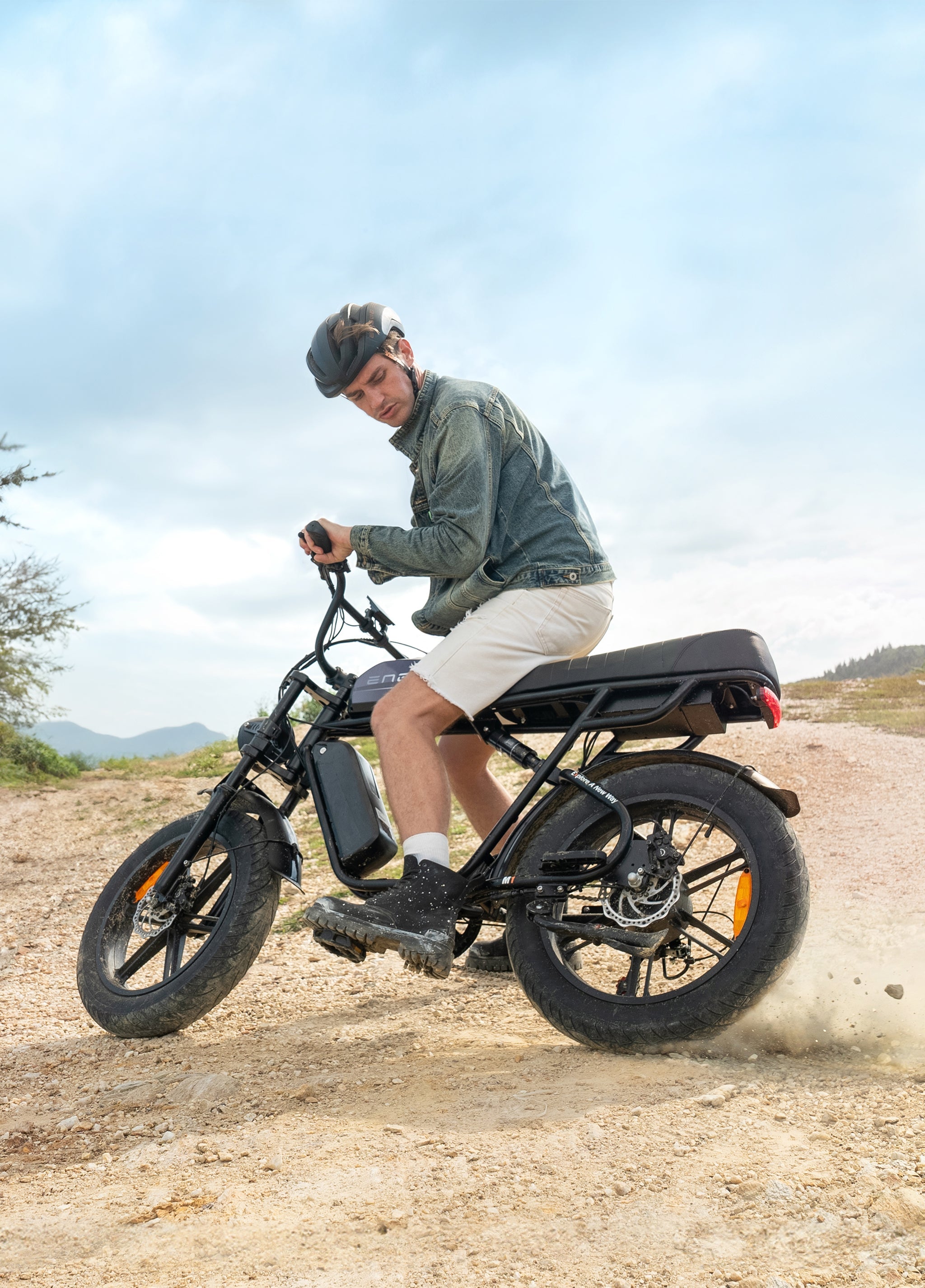ENGWE M1 e-bike in action, showcasing dual seats and rugged terrain performance.